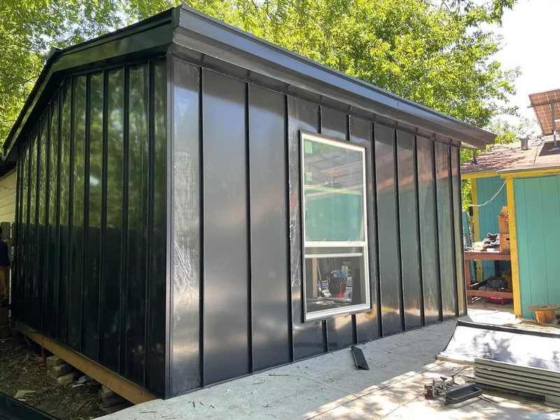 Black standing seam metal wall panels for Roof Inspection in Bothell